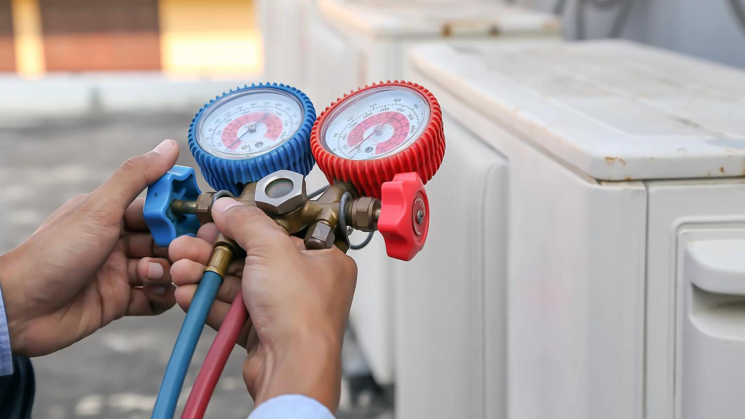 Technician performing air conditioning tune up in a residential home