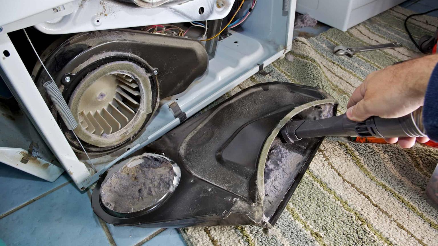 Technician repairing a dryer vent that is not blowing