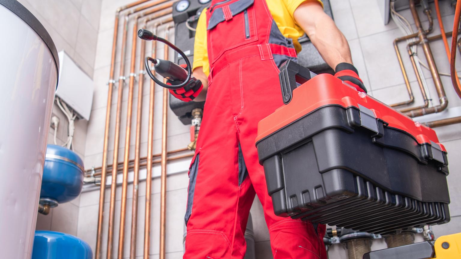 Emergency AC repair technician at work in Portland home - HVA Climate Control