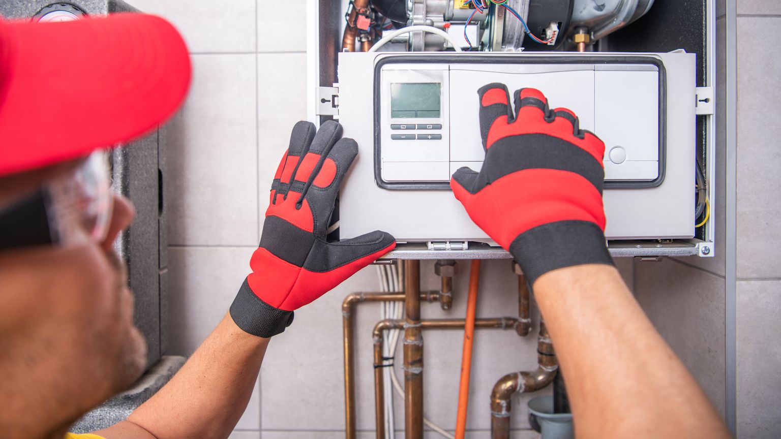 Experienced technician installing a gas furnace in a Battle Ground home