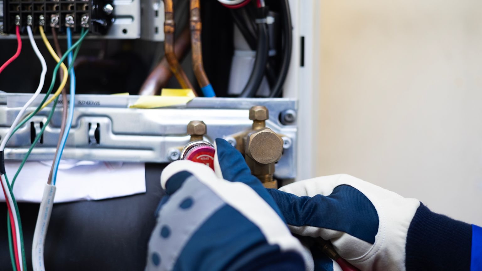 Certified technician installing a gas furnace in a Lake Oswego home