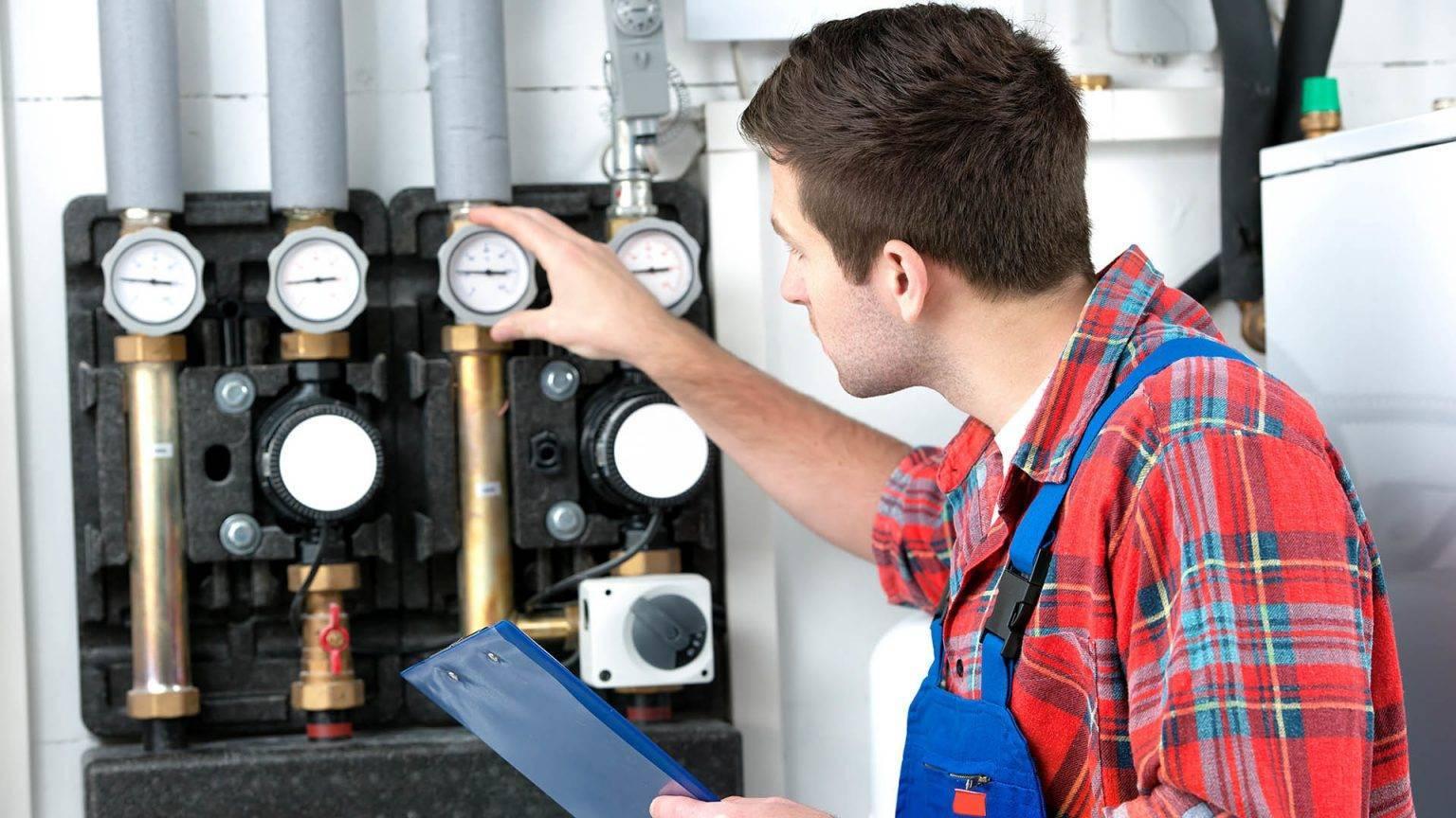 Specialist conducts repair of a gas furnace